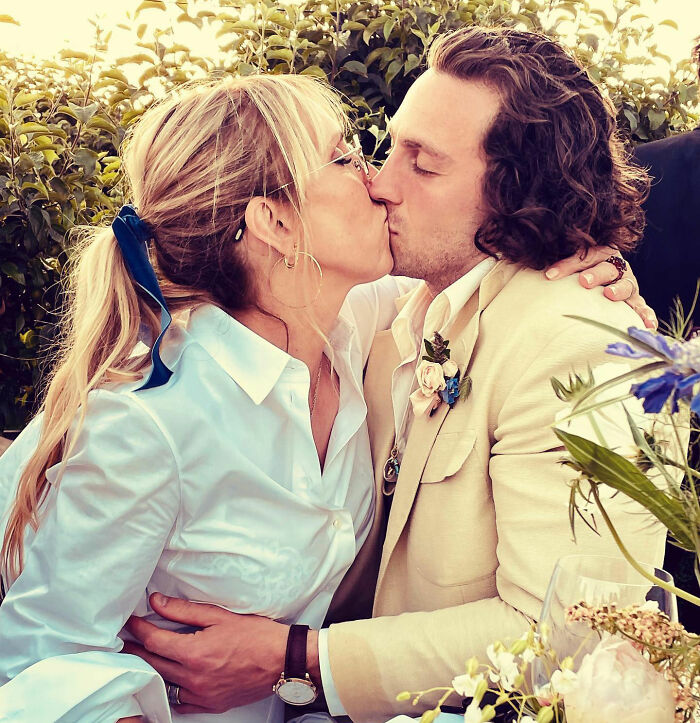 Aaron Taylor-Johnson kissing a woman outdoors, showing noticeable changes and an evolved form of Chalamet appearance. Aaron Taylor-Johnson kissing a woman outdoors, showing noticeable changes and an evolved form of Chalamet appearance.