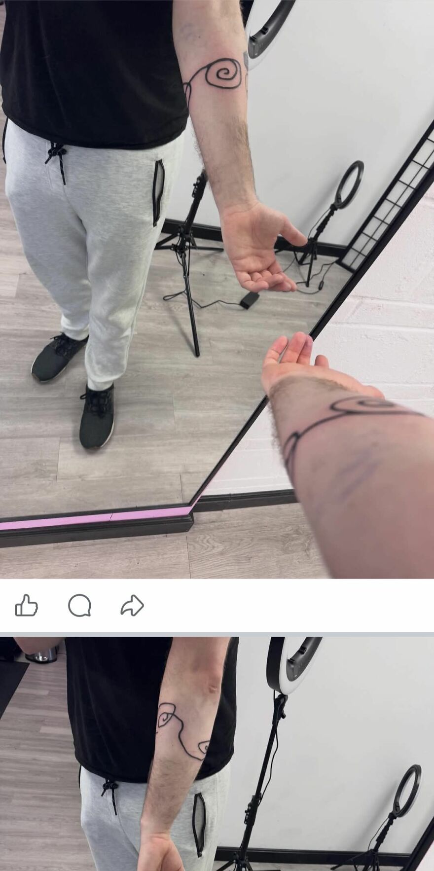 Man showing black spiral line arm tattoo in front of a mirror, part of tattoos that make you question the artists.