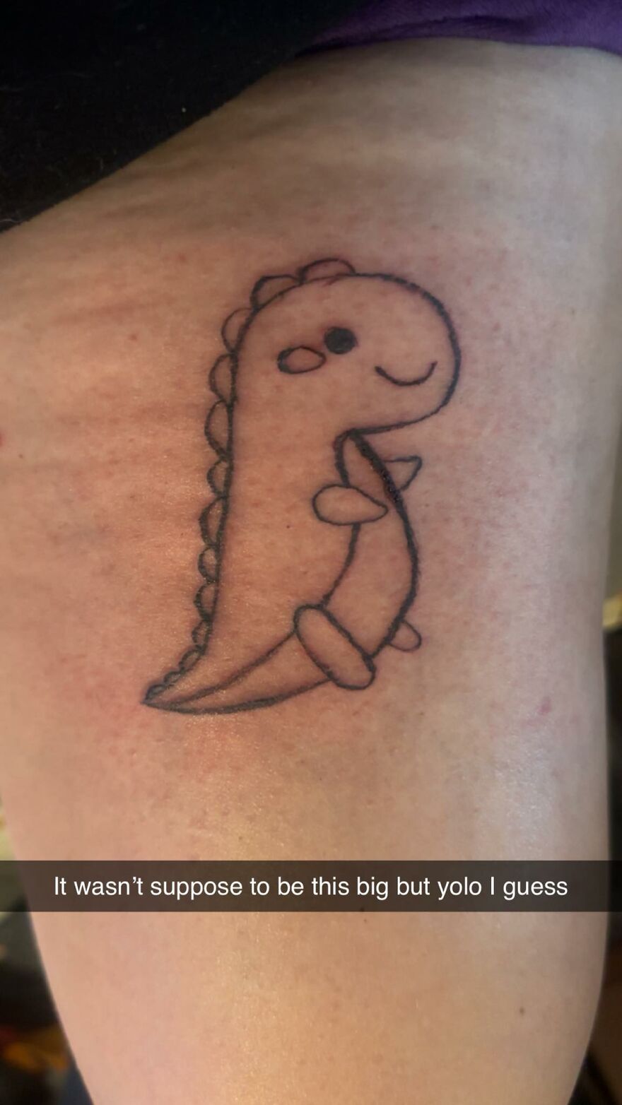 Cute dinosaur tattoo with simple black outlines on skin, one of the tattoos that make you question both the people and artists.