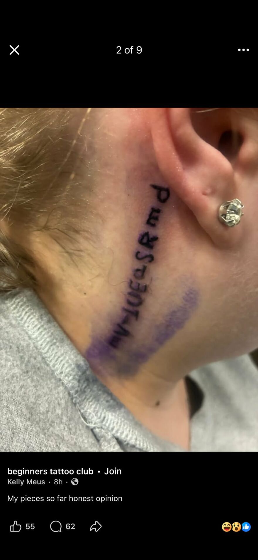 Close-up of a poorly done tattoo behind the ear with misspelled text questioning tattoo artists and choices.
