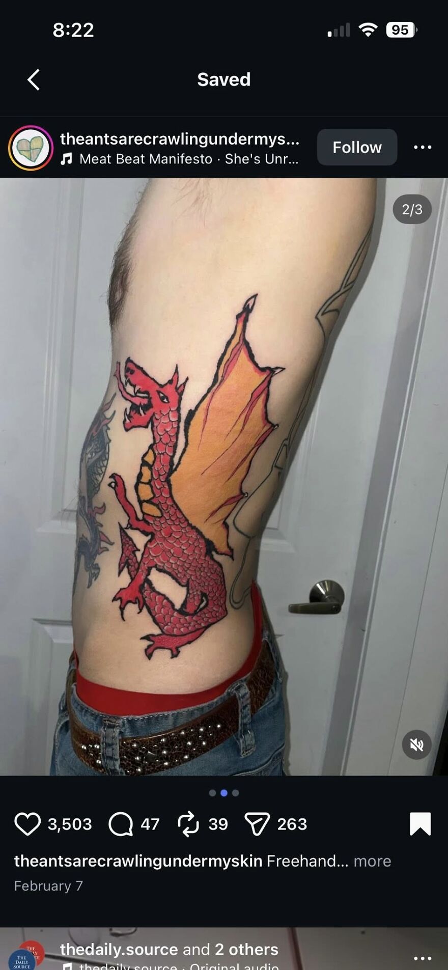 Red dragon tattoo with orange wings on a person's side, showcasing bold lines and vibrant colors in unique tattoo art.