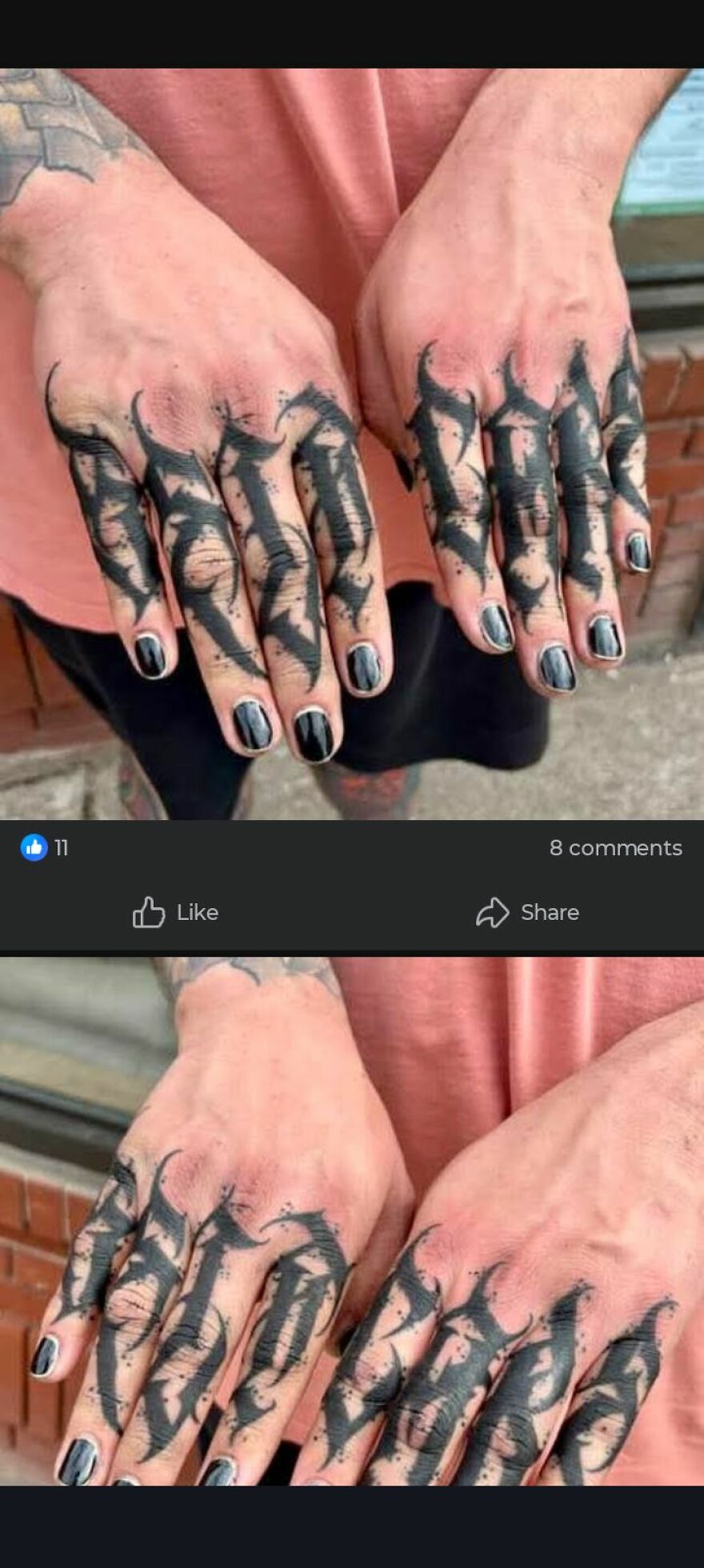 Black ink tattoos with distorted gothic lettering cover fingers of a person wearing a pink shirt and black nail polish.