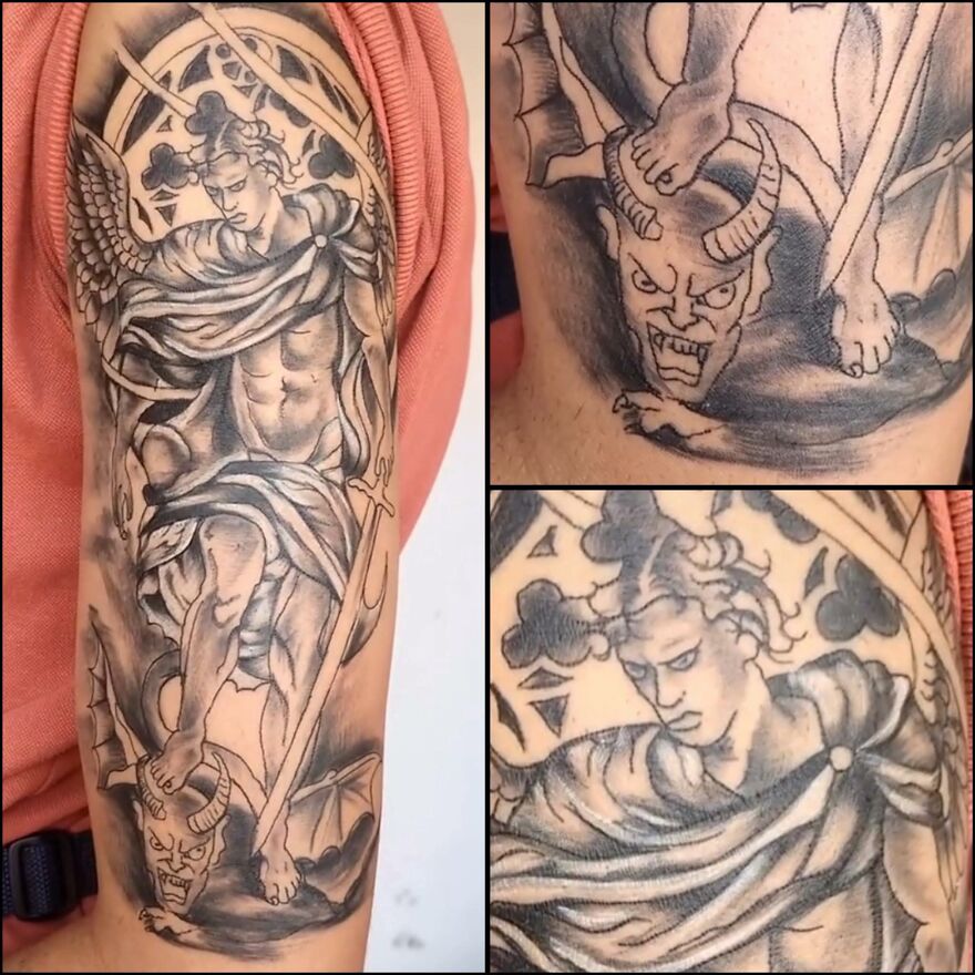 Black and grey tattoo of an angel defeating a demon, showcasing detailed shading and intricate linework on an arm.