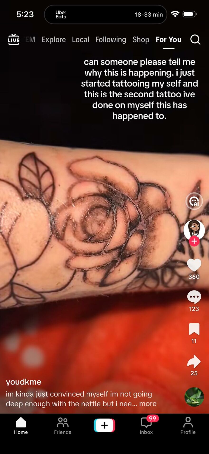Close-up of a poorly done self-tattooed rose on arm, raising questions about tattoos and the artists behind them.