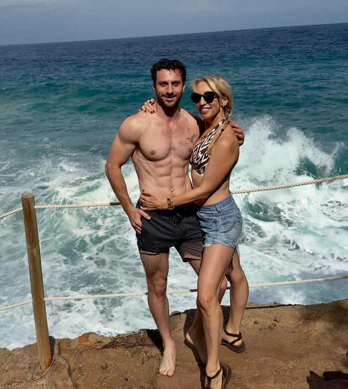 Aaron Taylor-Johnson standing shirtless by the ocean with a woman, showing changes sparking fan concern. Aaron Taylor-Johnson standing shirtless by the ocean with a woman, showing changes sparking fan concern.