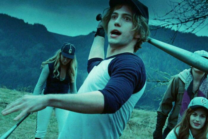 Hilarious movie details from Twilight, showing a character playing baseball in a nonsensical way.