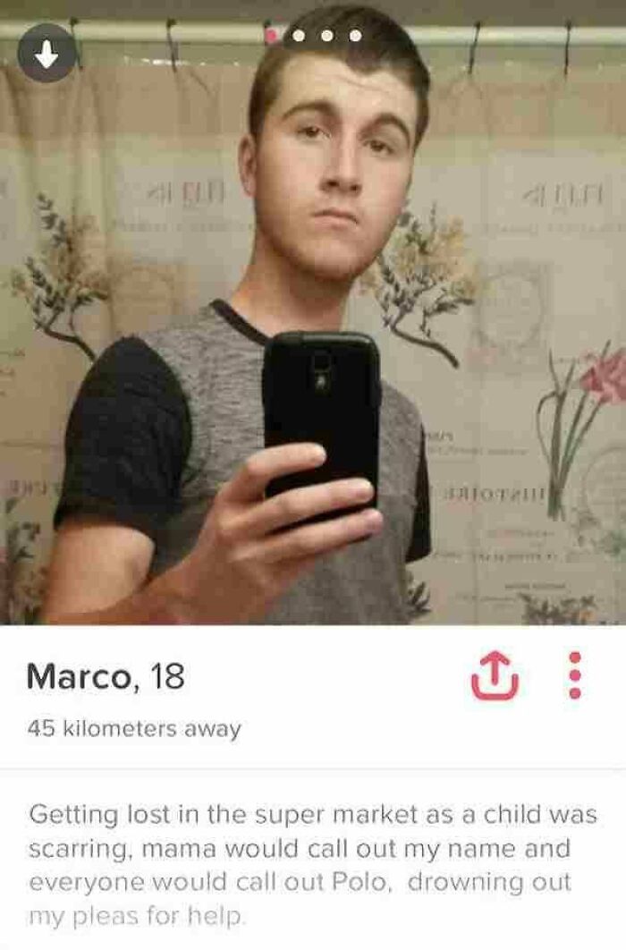 Young man taking a mirror selfie on Tinder profile with a humorous bio, part of funny Tinder profiles collection.