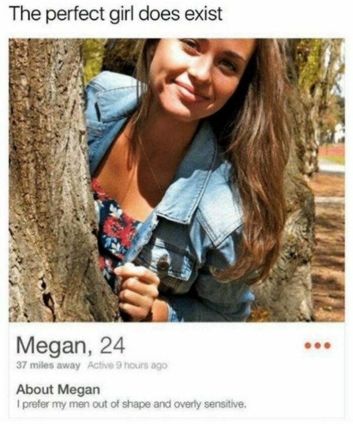 Young woman smiling behind tree with Tinder profile text showing dating preferences and personality traits.