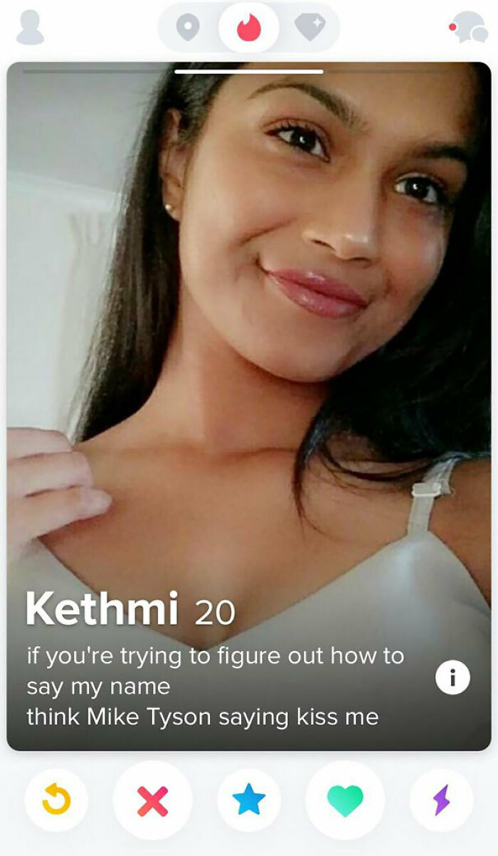 Close-up of a woman smiling on a Tinder profile that highlights funny and cringe dating profile moments.