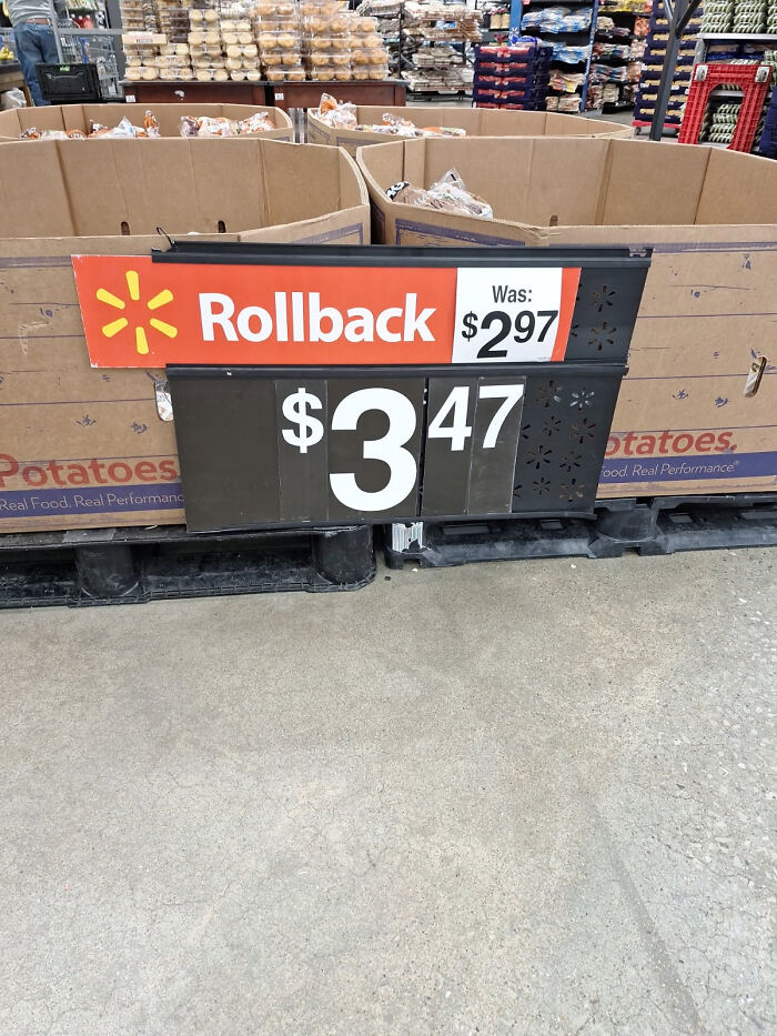 A funny 'you had one job' fail at a store where a rollback sign shows a higher price ($3.47) than the original price ($2.97).