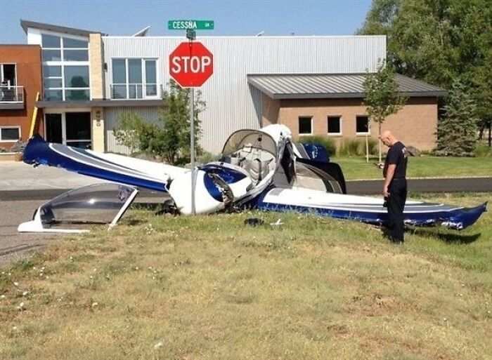 Small plane crashed into stop sign with man standing nearby, showing a sarcastic image that hits different for irony.