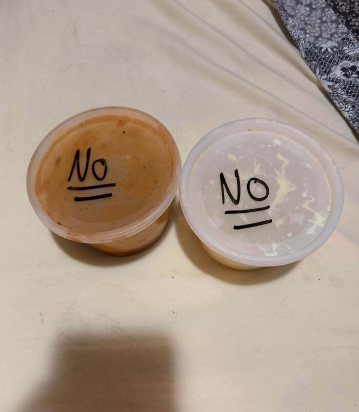 Two small plastic containers with lids labeled no, illustrating entitled family members' delusional behavior in a casual setting.