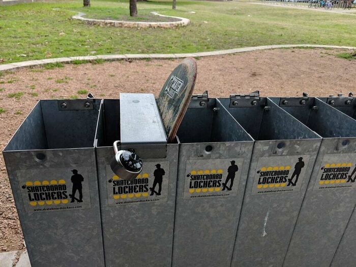 Metal skateboard lockers in a park with a lock securing a skateboard, showcasing a smart solution to storage problems.