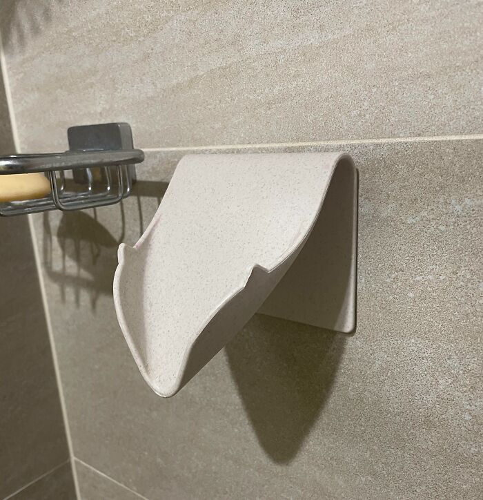 Wall-mounted bathroom accessory with curved design, one of the unidentified objects solved by the internet mystery.