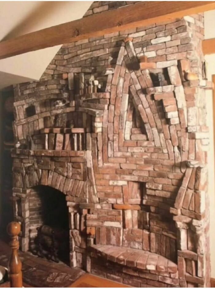 Intricately designed brick fireplace inside an abandoned home showcasing disturbing and weird things found in forgotten houses.