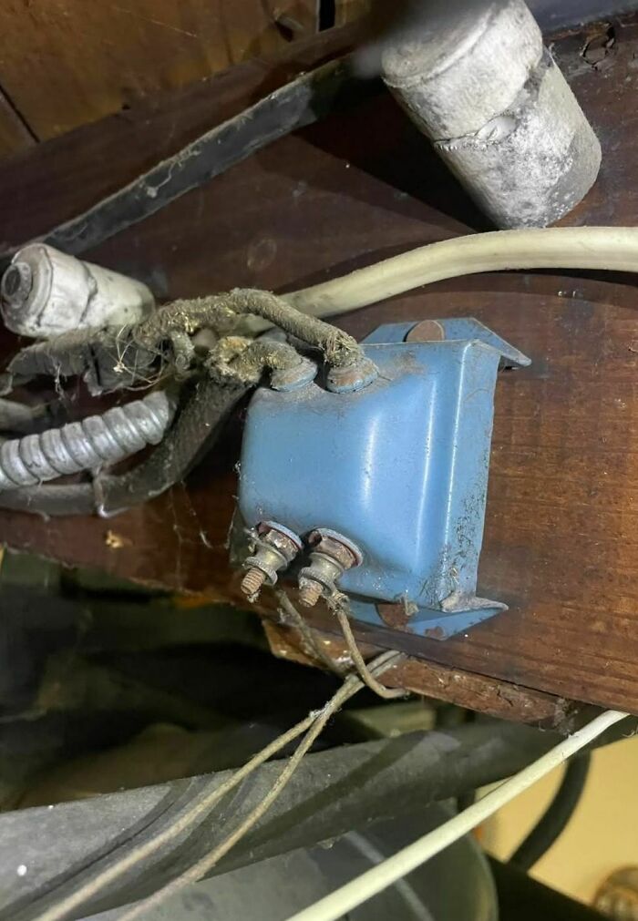 Old dusty electrical component with frayed wires found among disturbing and weird things in abandoned homes.