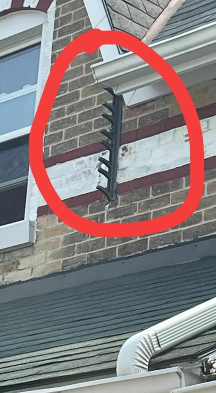 Metal spikes attached to brick wall circled in red, a disturbing and weird thing found in abandoned or forgotten homes