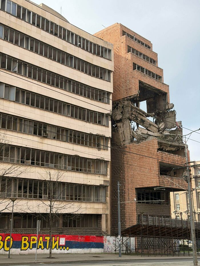 Eerie urban hell with damaged empty buildings and broken concrete structure