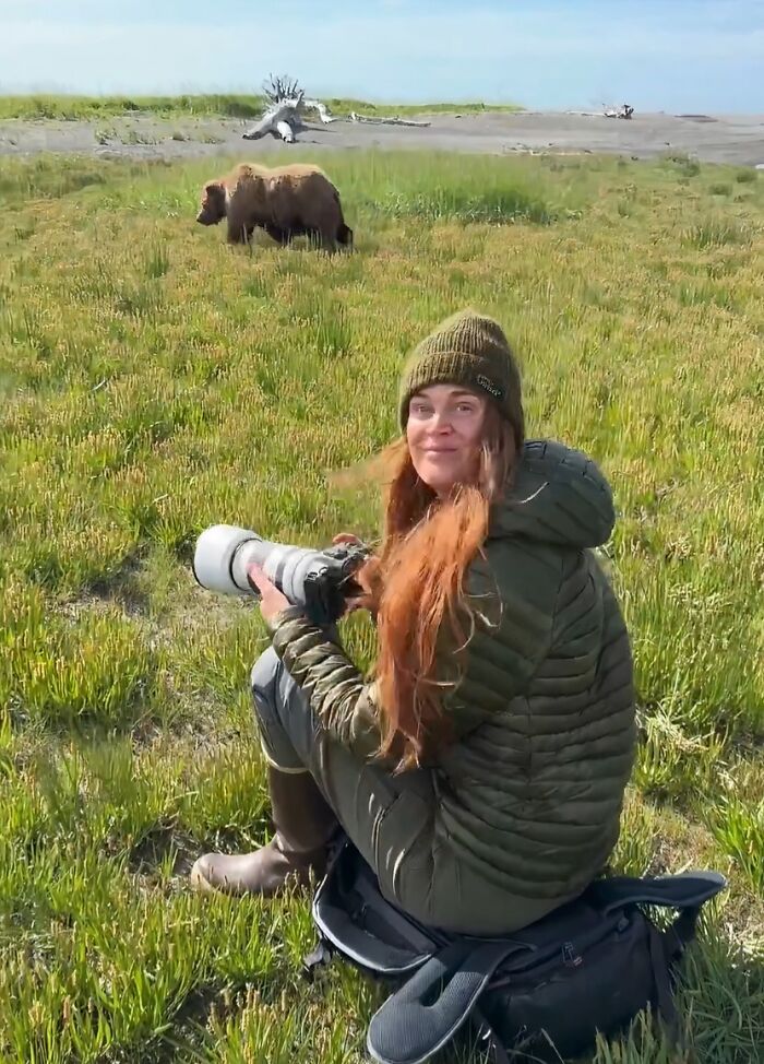 Female wildlife photographer in outdoor gear capturing images with a telephoto lens, highlighting women using power tools and lab coats.