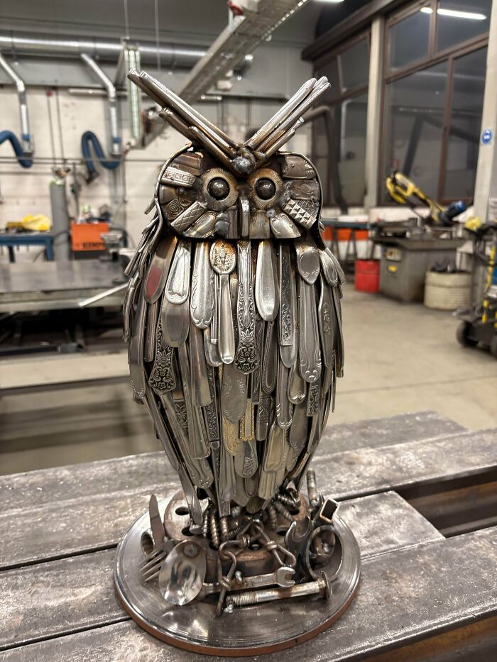 Owl sculpture made from repurposed silverware and metal parts, showcasing creative DIY wins and artistic craftsmanship.