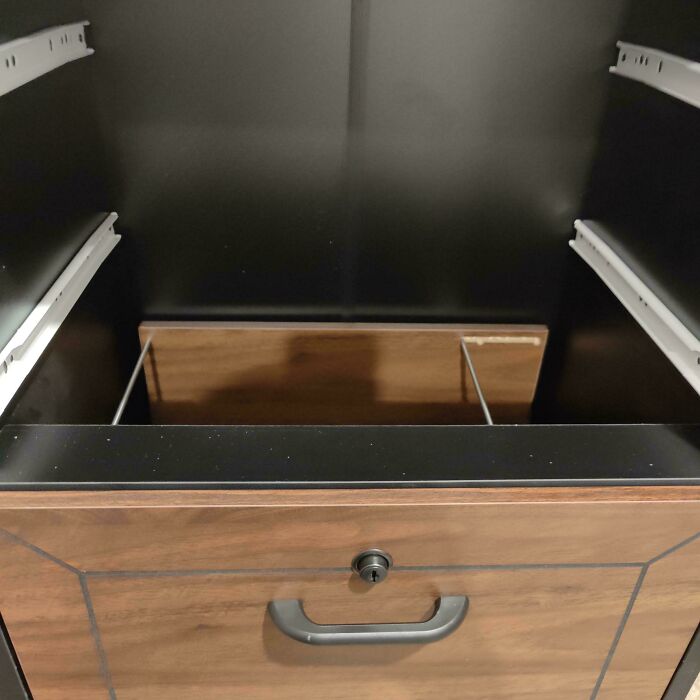 A Locking Drawer That Can Be Bypassed By Removing The Upper Drawers