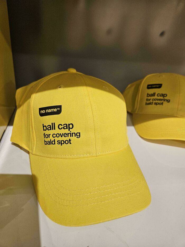 A mildly interesting picture of a yellow ball cap for covering bald spots with no name brand.