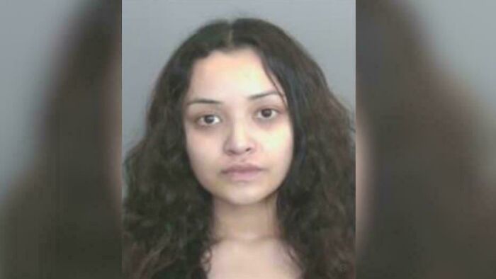Mugshot of woman with curly hair morbid curiosity stories