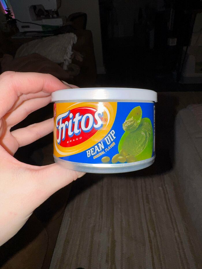 A hand holding a can of Fritos Bean Dip, an image that had people asking questions.