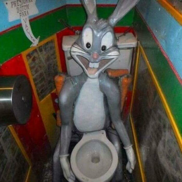 A baffling image of a creepy Bugs Bunny statue sitting on a toilet, a peculiar sight for internet answers.