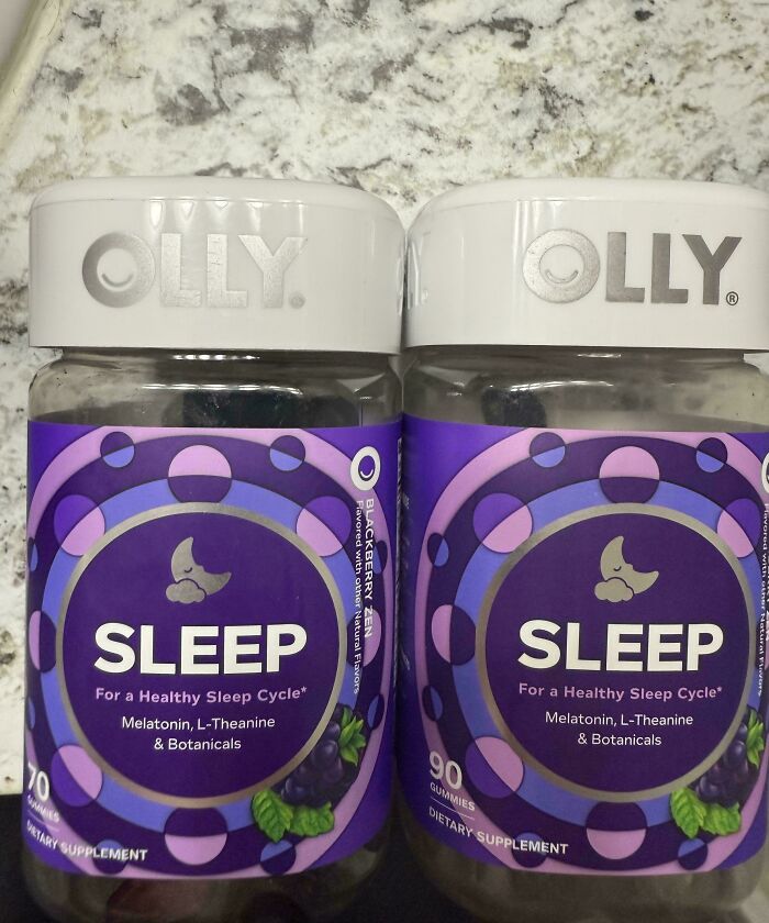 Olly Sleep dietary supplements with different gummy counts on granite countertop