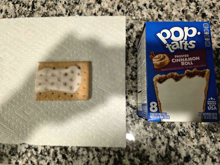 Pop Tarts box with missing cinnamon roll image and single pastry on paper towel