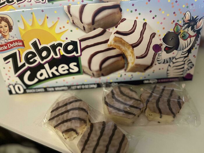 Little Debbie Zebra Cakes box with three small cakes, one partially eaten