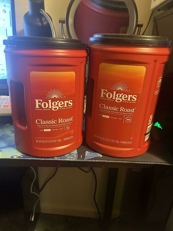 Two containers of Folgers Classic Roast coffee with different weights