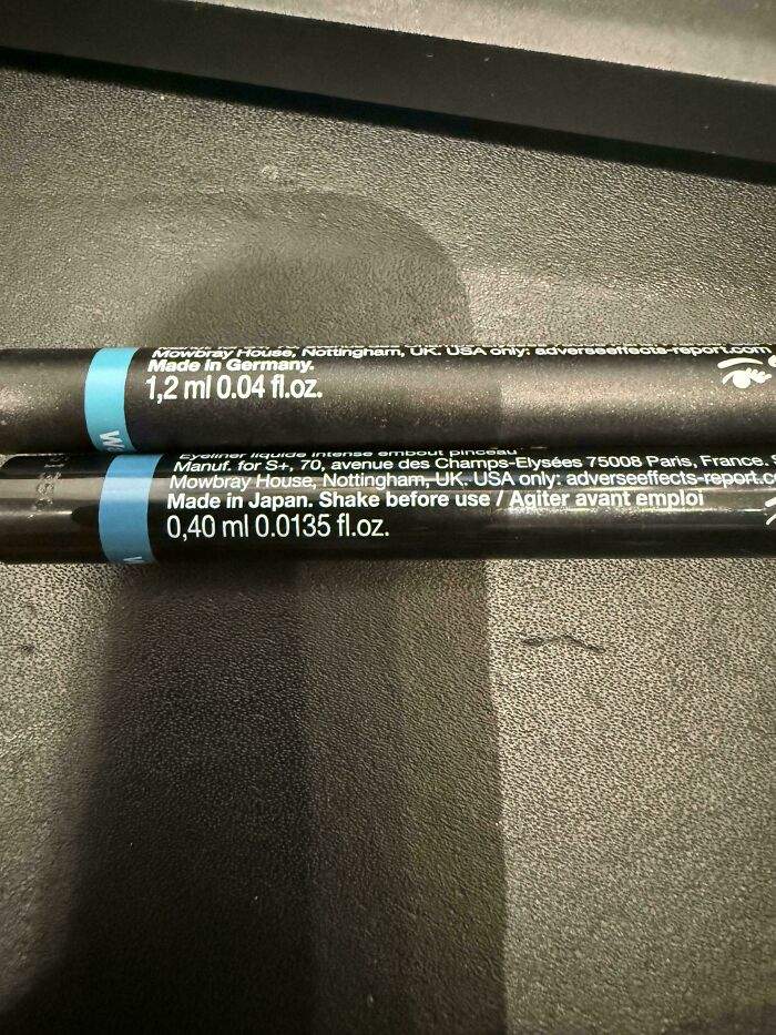 Close-up of two eyeliners with different volume labeling from Germany and Japan