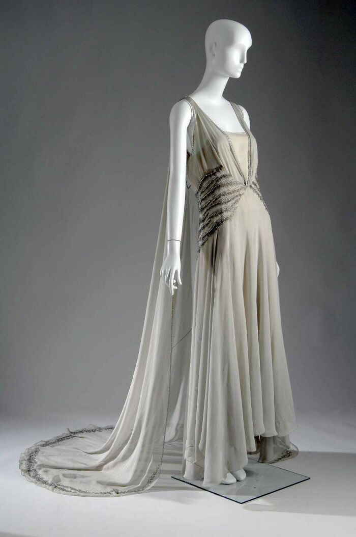 Presentation Gown Designed By Madeleine Vionnet For Mrs. Palmer II When Presented To The English Royal Family, Made Of Gray Silk Chiffon, With Rhinestone Trim At Edges And Waist, 1938. Chicago Historical Society