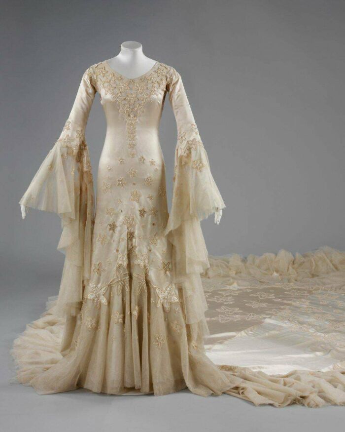 1933. Wedding Dress Of Margaret Whigham, Later The Dutchess Of Argyll. Crafted From Satin And Tulle, Embroidered With Delicate Glass Beads