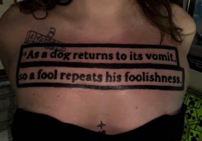 Bold chest tattoo fail with large text about foolishness in black ink