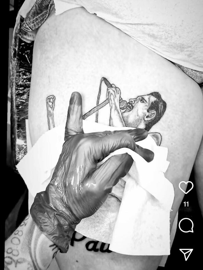 Black and white awkward tattoo of singer with gloved hand