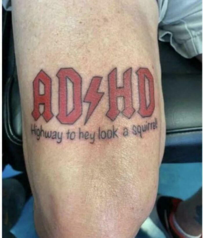 Funny ADHD tattoo with distracted slogan on skin