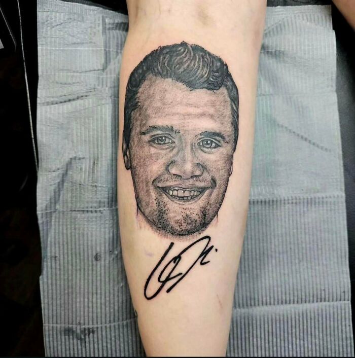 Tattoo fail of an unrealistic portrait tattoo with distorted facial features