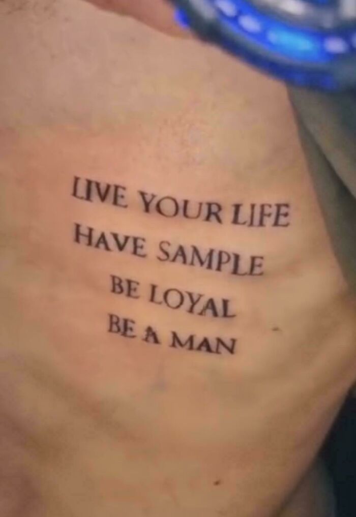 Leg tattoo of a distorted face with beetlejuice text showing tattoo fails