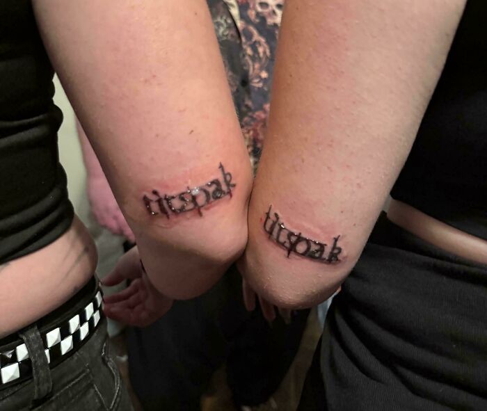 Matching tattoo spelling error on elbows