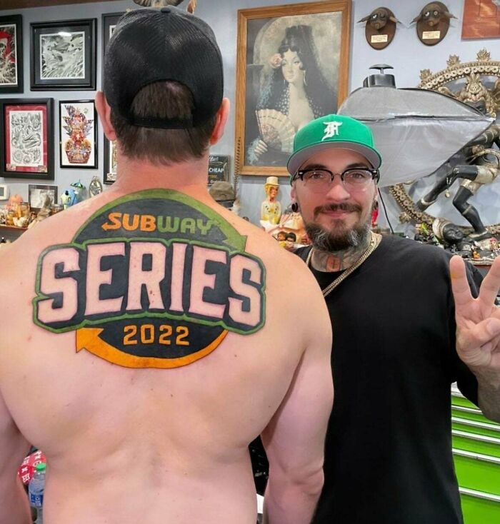 Back tattoo of Subway Series 2022 logo with person posing