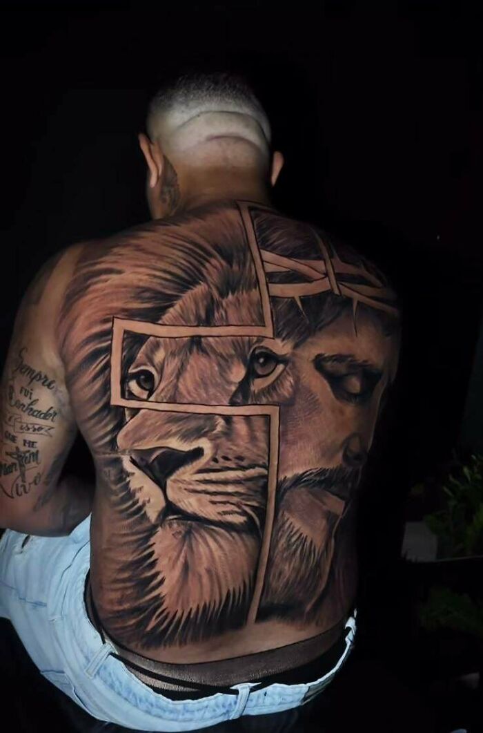 Back tattoo featuring a lion and a face with a cross outline in tattoo fails