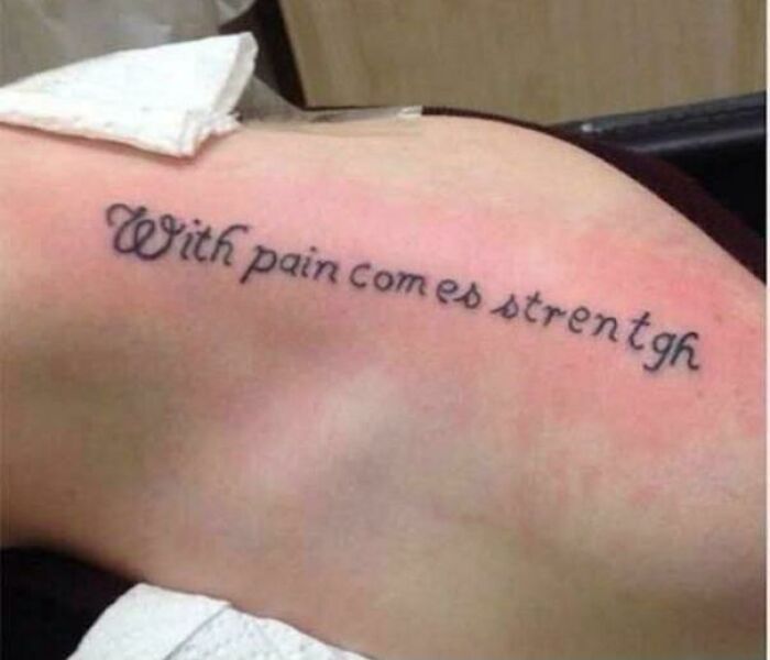 Misspelled inspirational quote tattoo on shoulder with spelling error