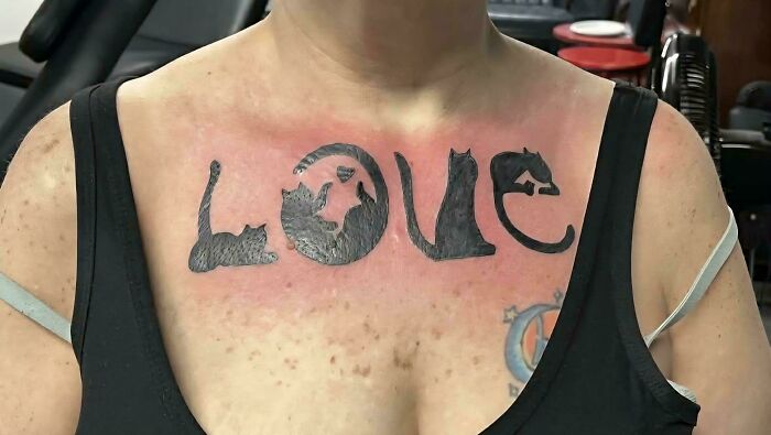 Cat themed tattoo spelling out love on chest tattoo fails
