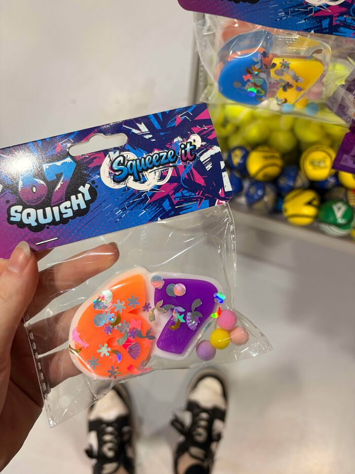 Hand holding a plastic bag with colorful squishy toys, showing cringey people examples.