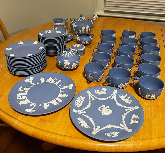 A remarkable collection of blue and white Wedgwood china, featuring various plates, cups, and a teapot.