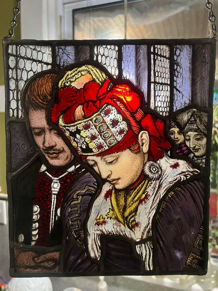 Remarkable antiques: A beautiful stained glass panel depicting people in traditional attire.