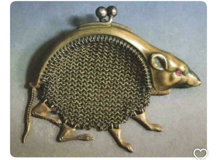 Remarkable antiques: A brass coin purse shaped like a rat with chainmail body, a unique find.